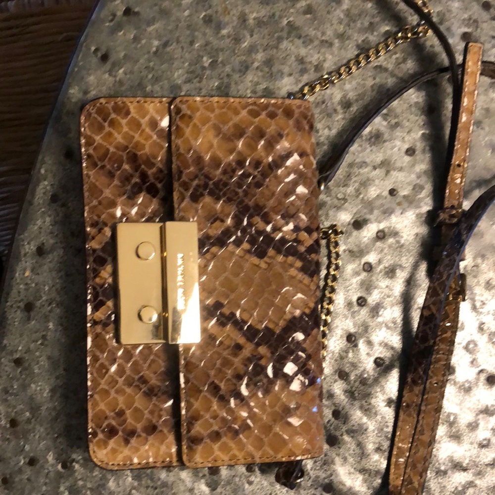 Michael Kors Snakeskin clutch 5x8 like new.